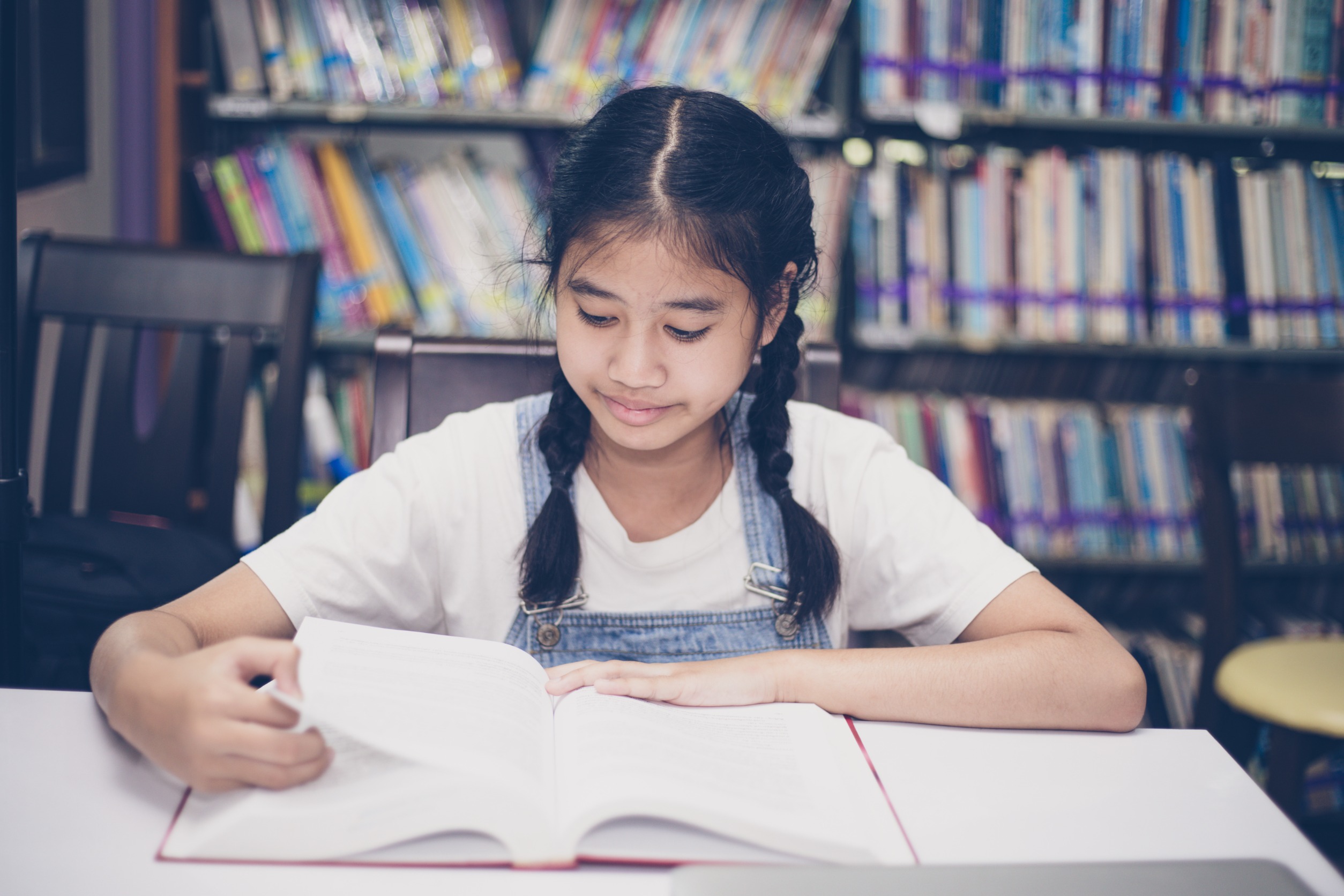 Student studying with book.