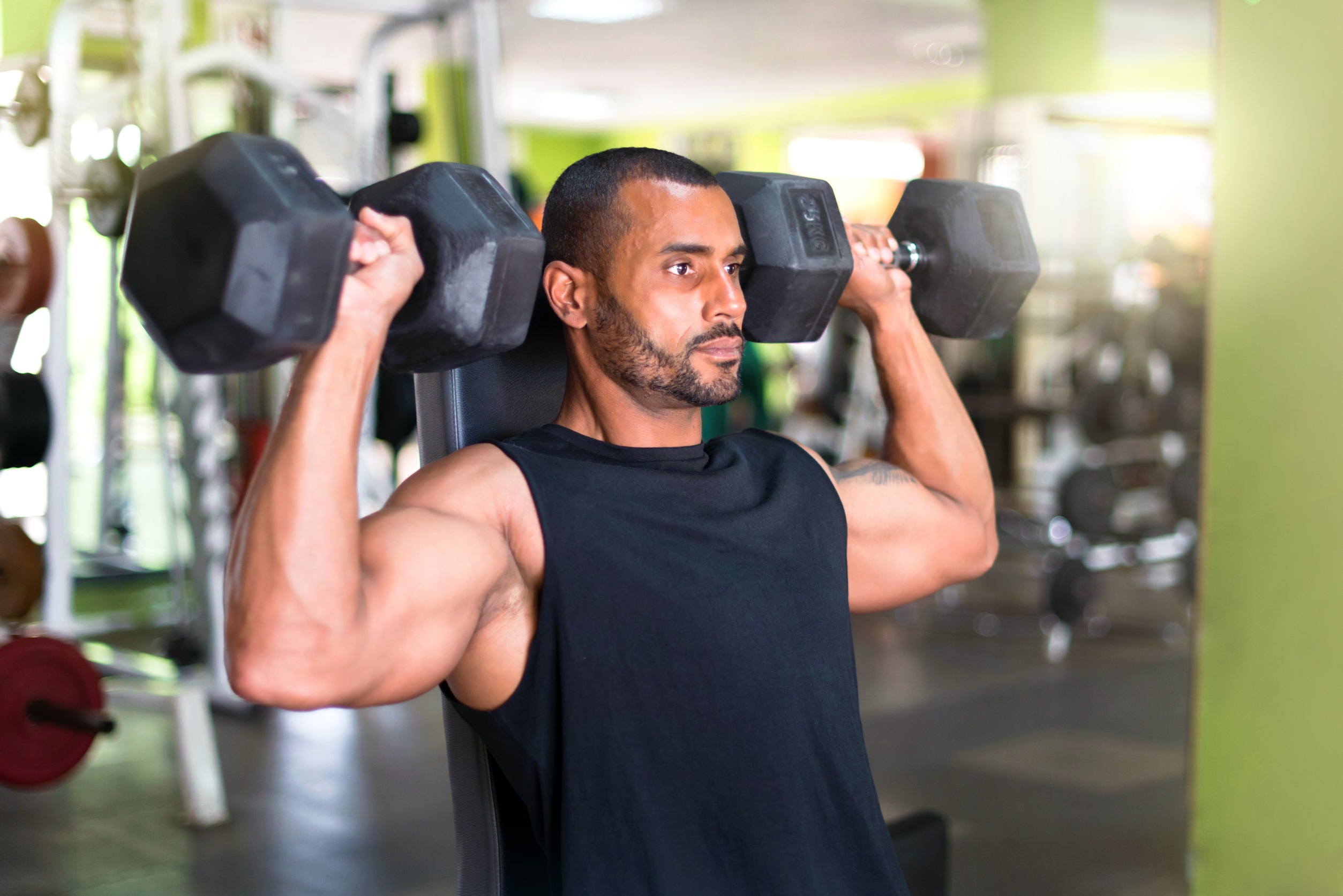 Man lifting weights in gym