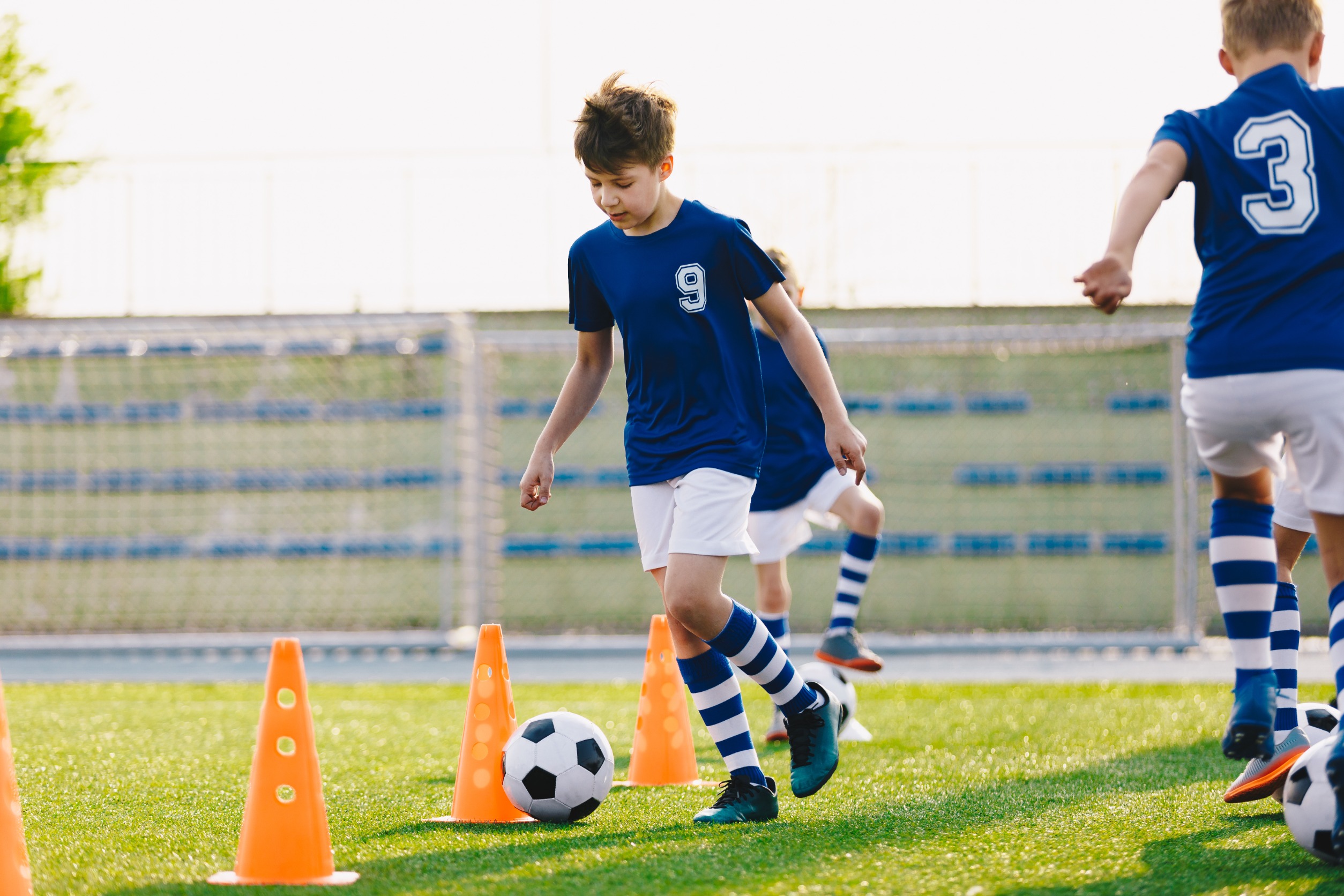 Children practicing soccer, one of the youth sports offered at the Y