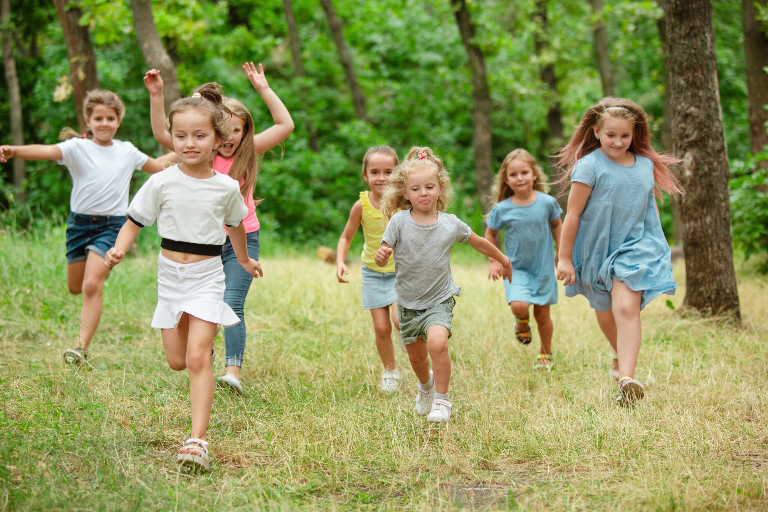 Children running in the grass