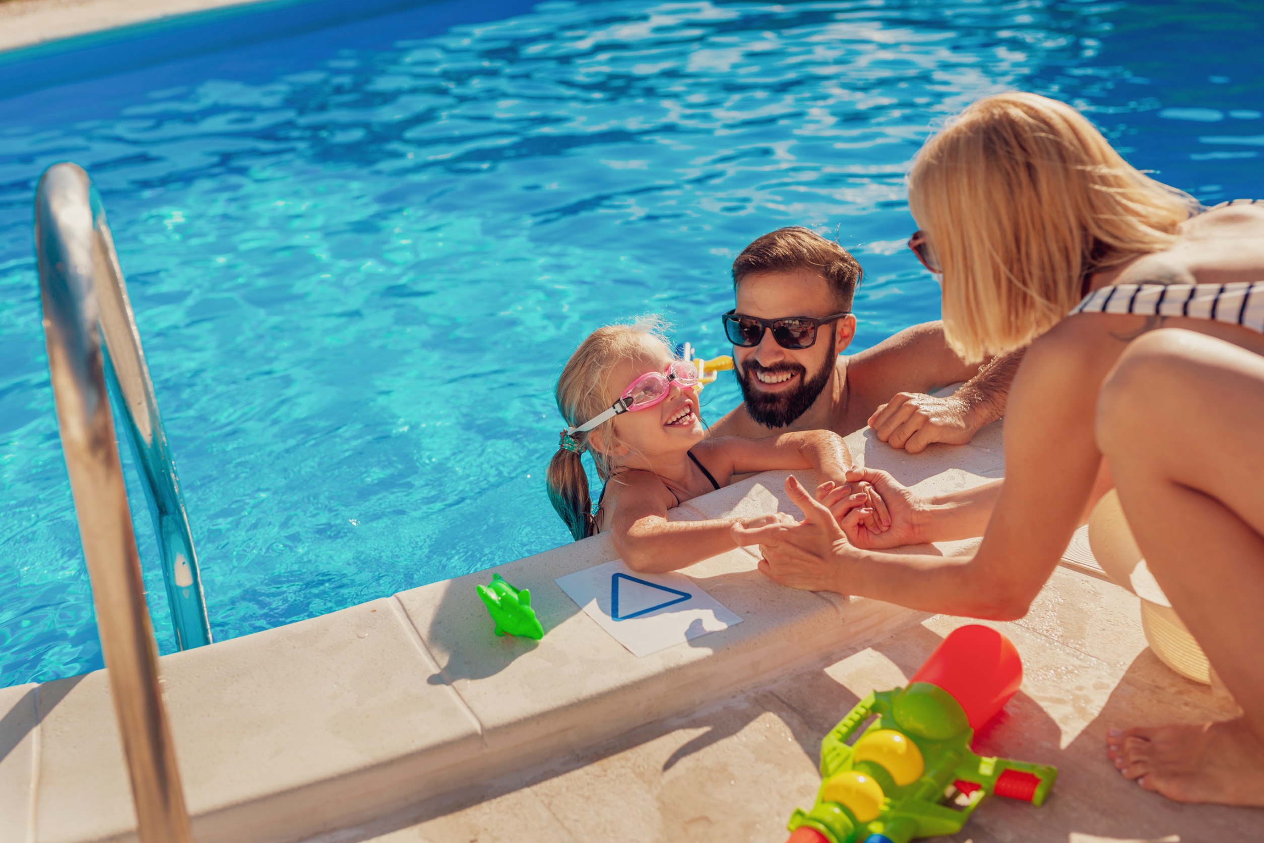 Parents and child in pool