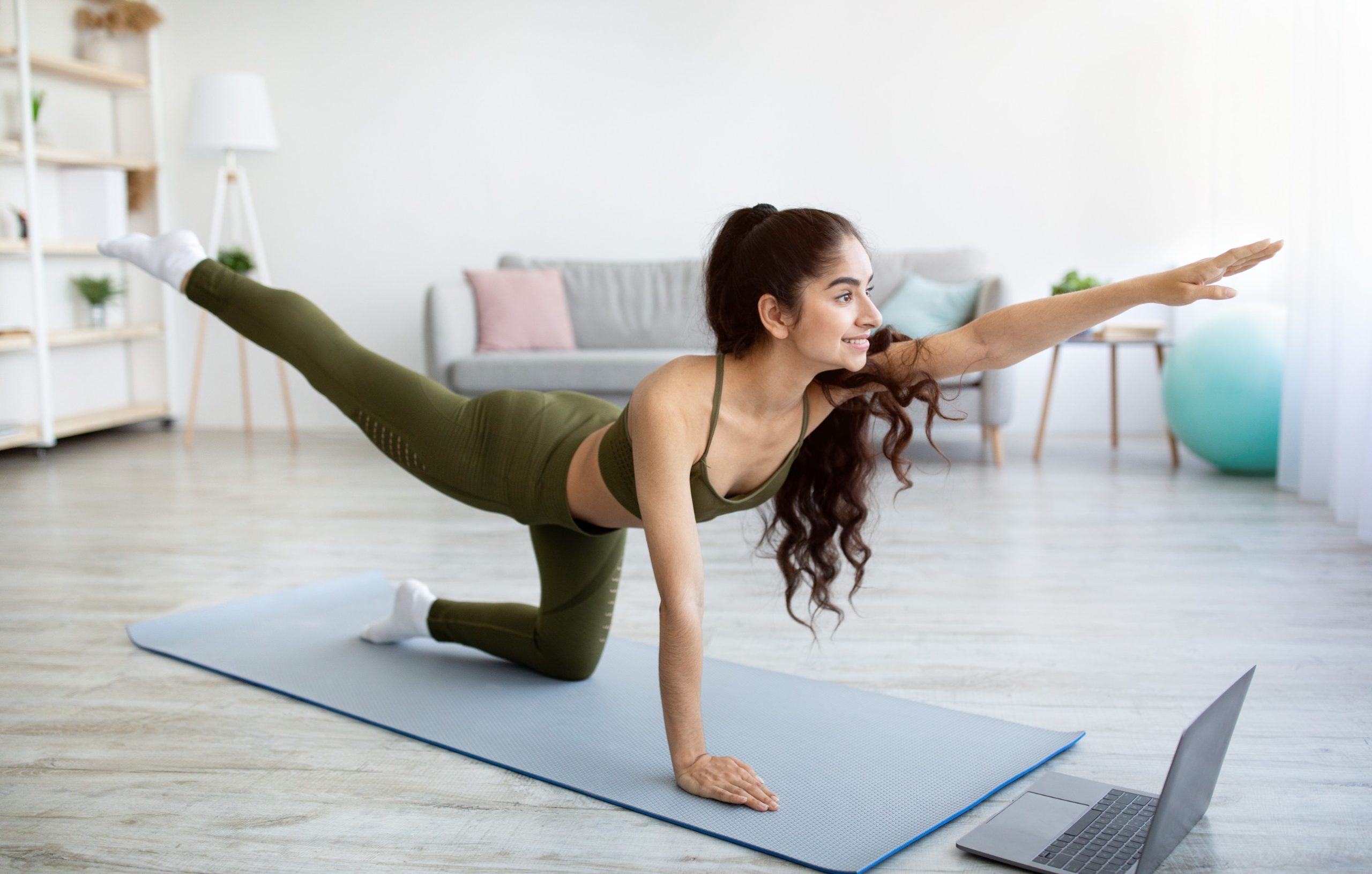 Woman participating in an online fitness class