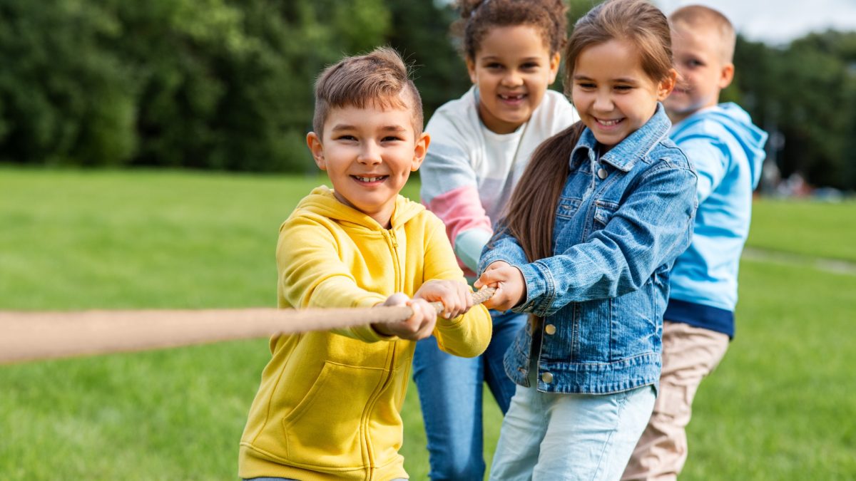 Children playing tug-o-war at a YMCA summer camp