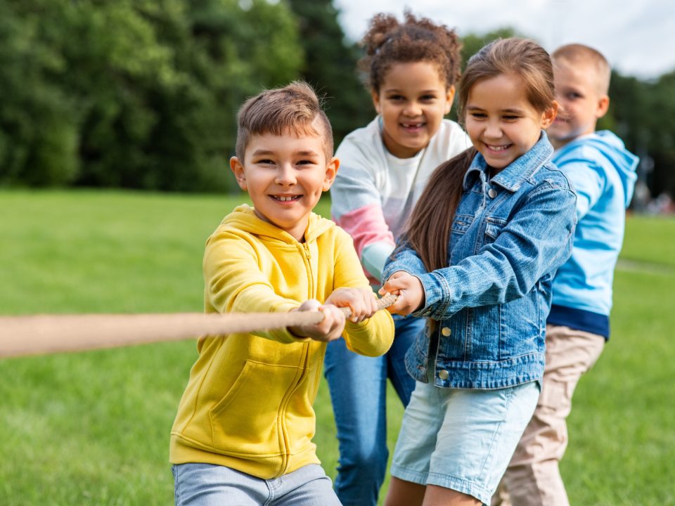 Children playing tug-o-war at a YMCA summer camp