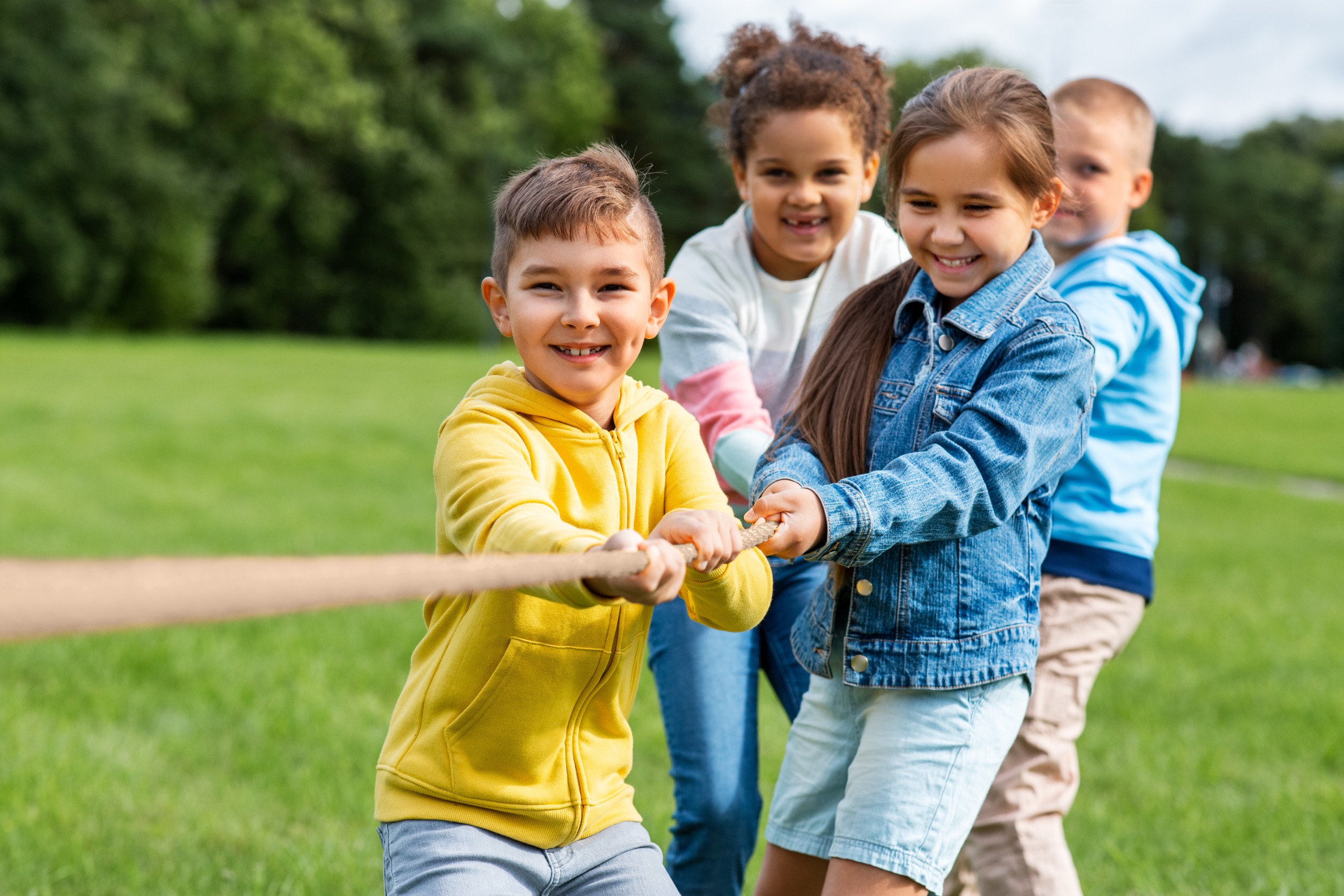 Children playing tug-o-war at a YMCA summer camp