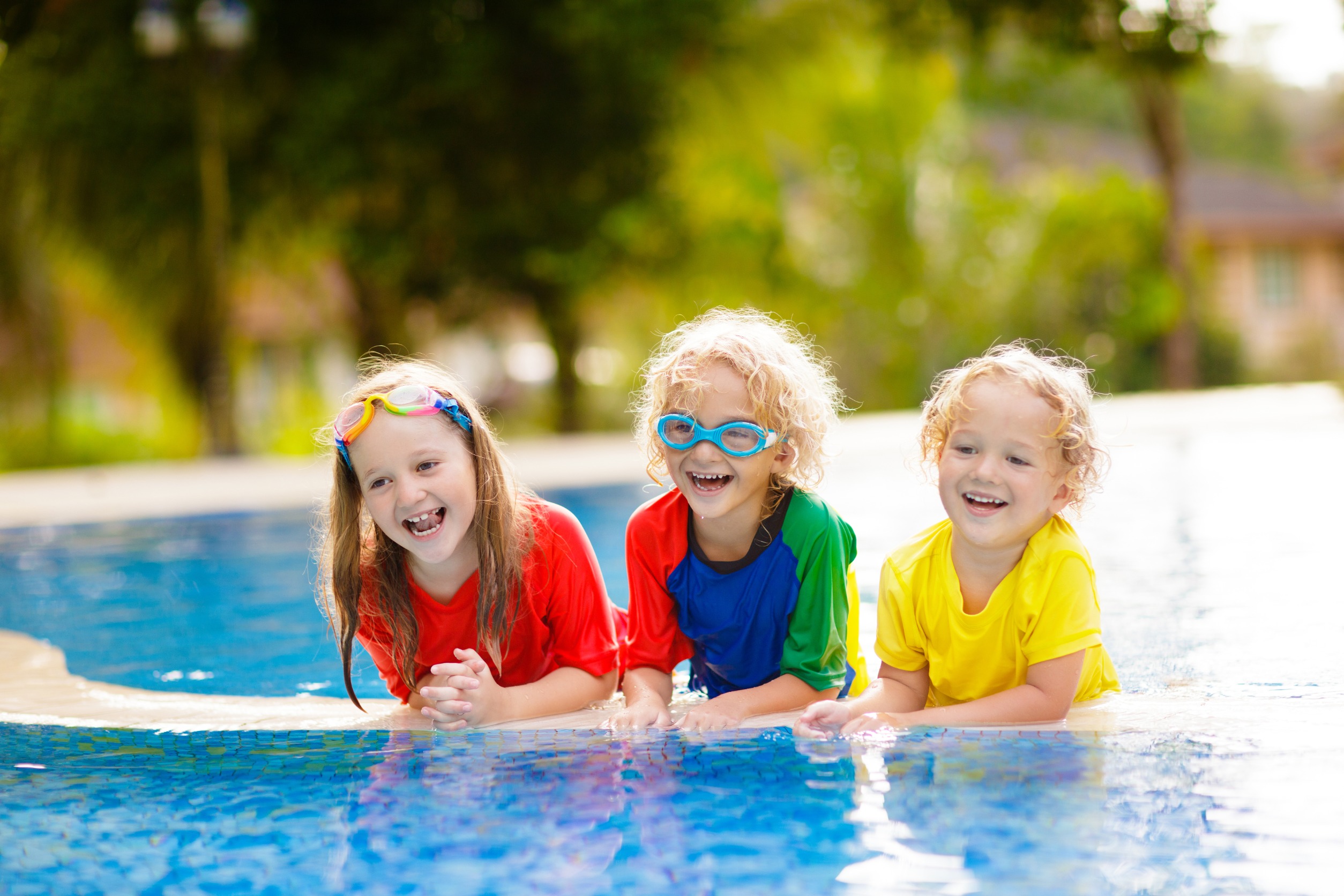 Kids on a floaty in a pool