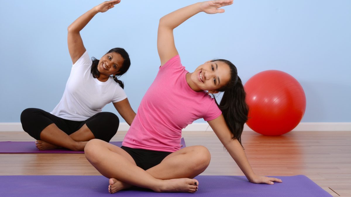 Teen girl working out in gym