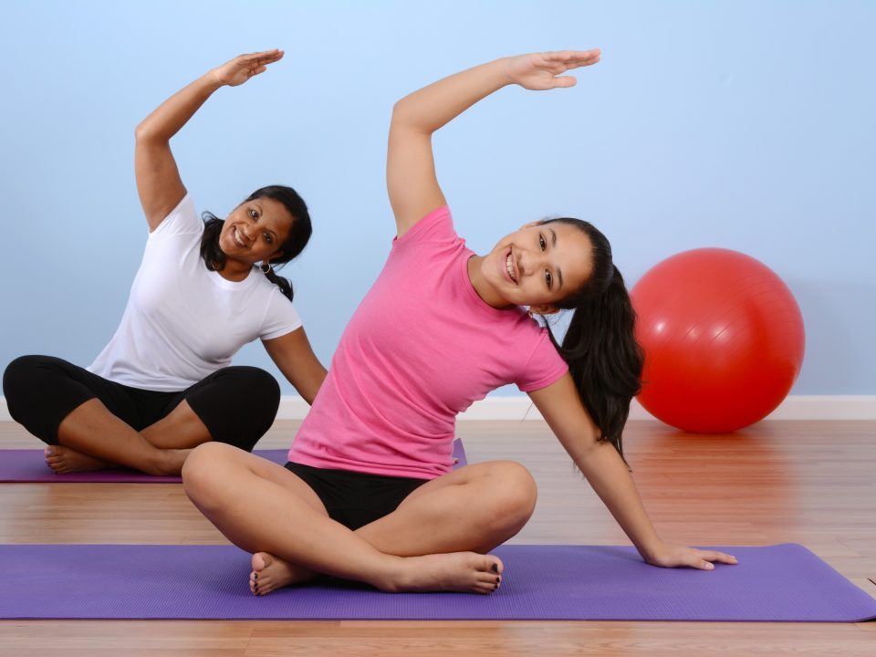 Teen girl working out in gym