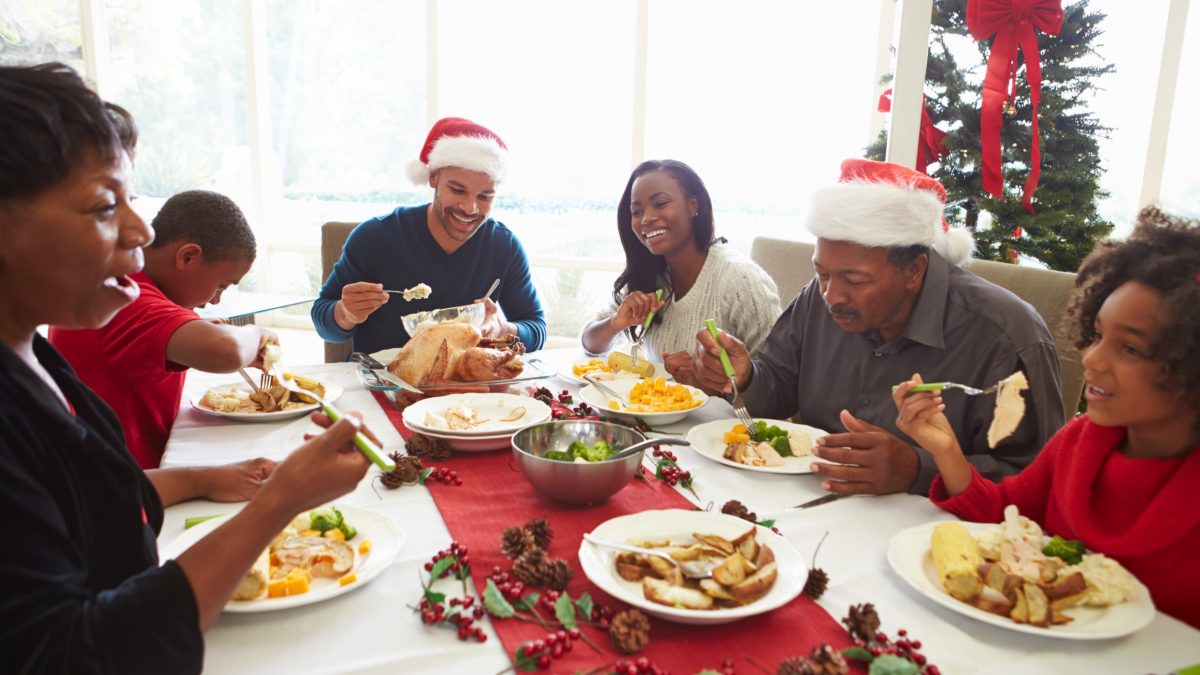 Family enjoying Christmas dinner together.