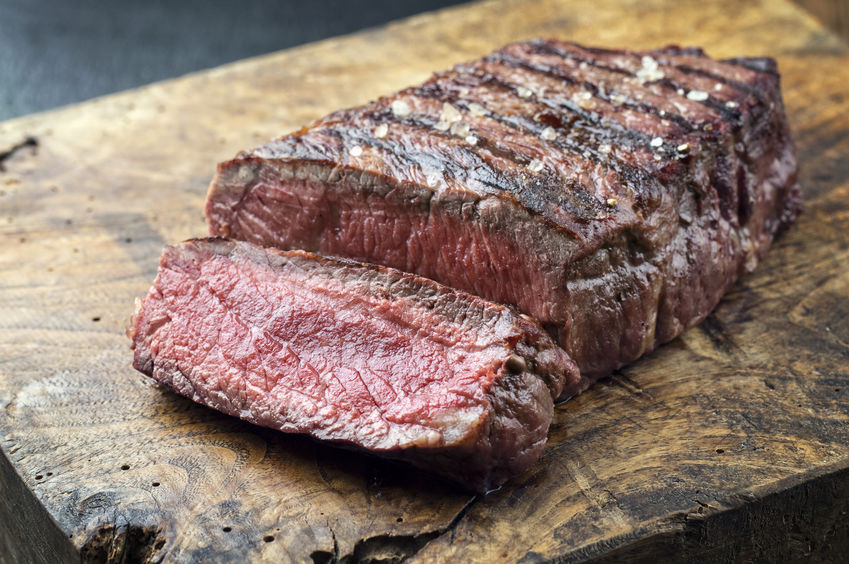 sirloin steak on a wooden plank