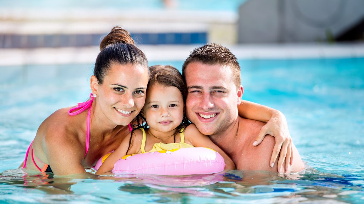 Family in swimming pool