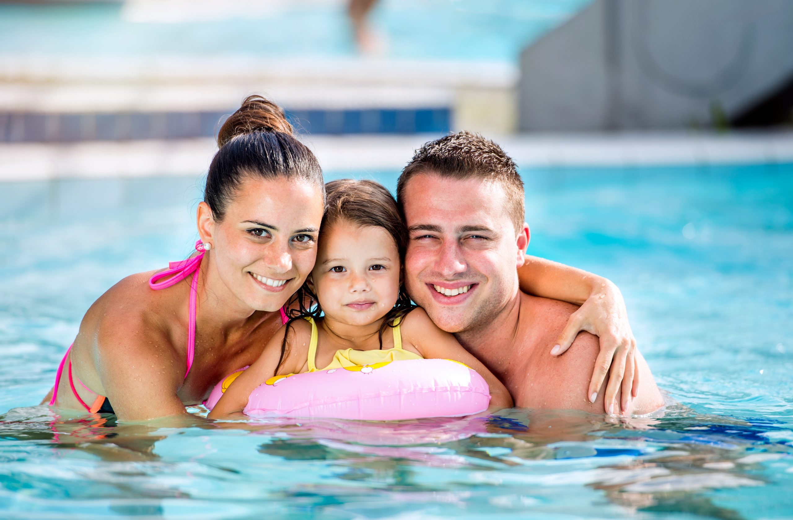 Family in swimming pool