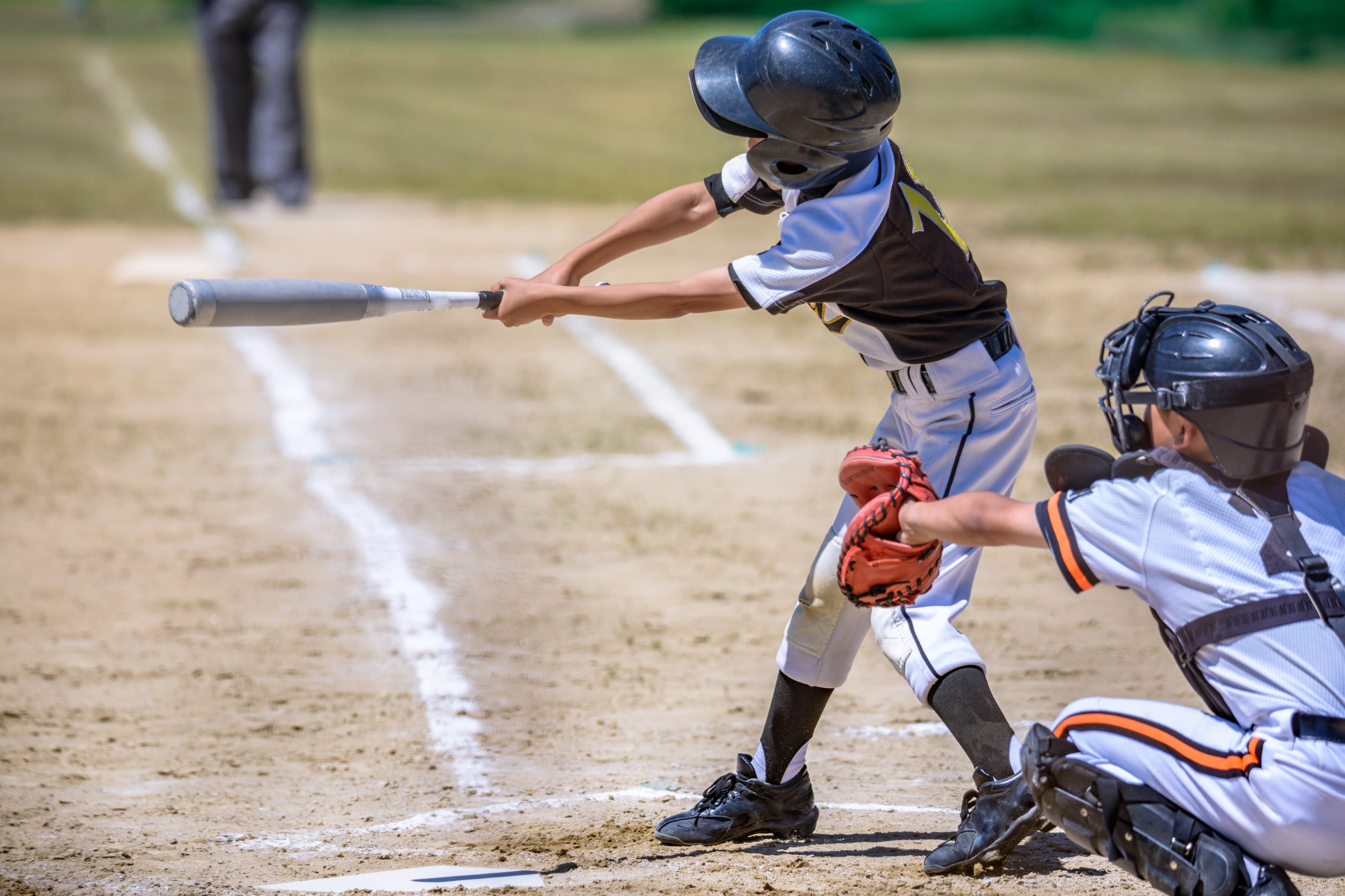 Kids playing baseball.