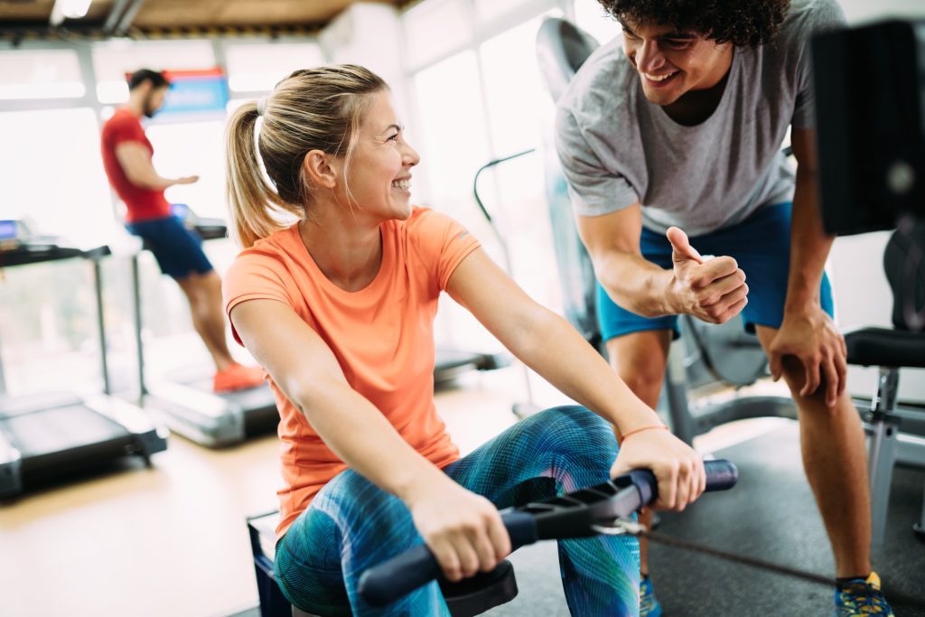 Woman working out with her personal trainer.