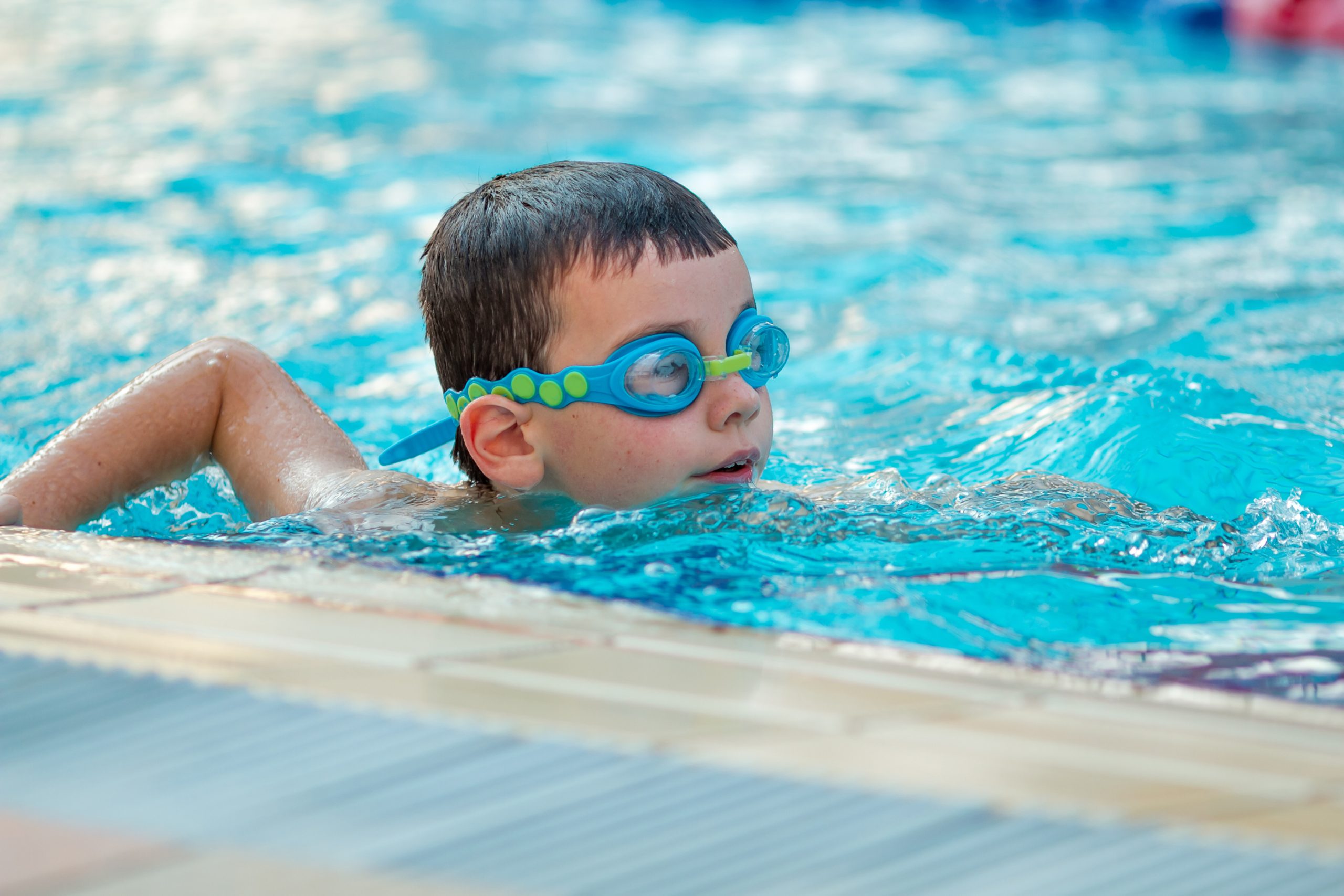 Boy swimming in pool