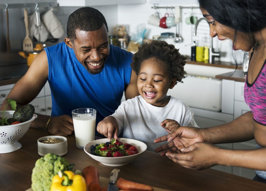 a cute little boy learning about diabetes treatment with healthy food