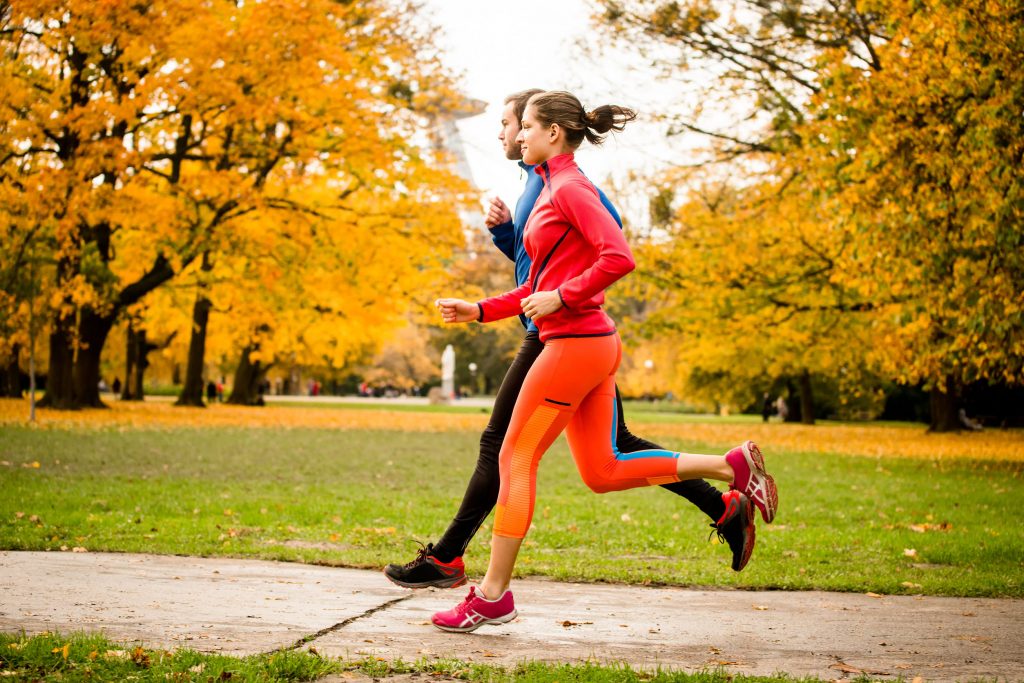 Couple enjoying new ways to exercise in the fall.