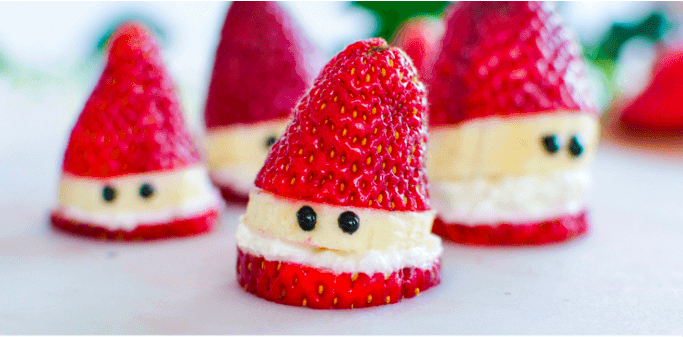 Santas made from strawberries, bananas, cream cheese, and icing