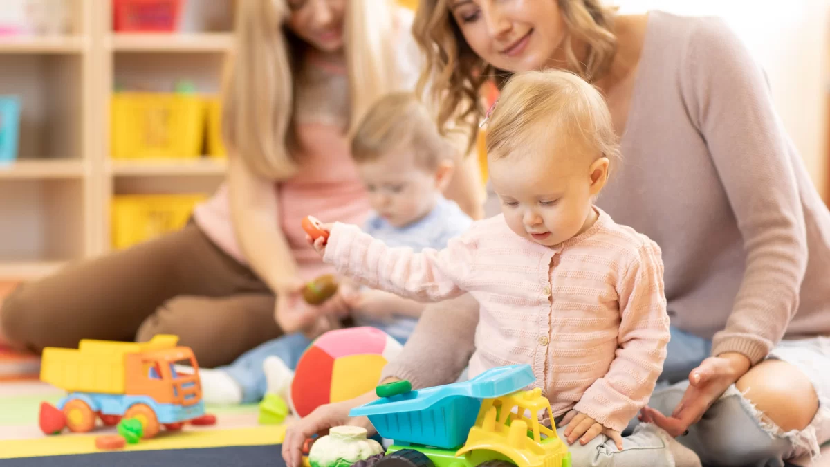 Staff playing with children