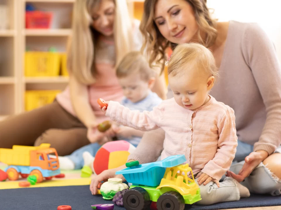 Staff playing with children