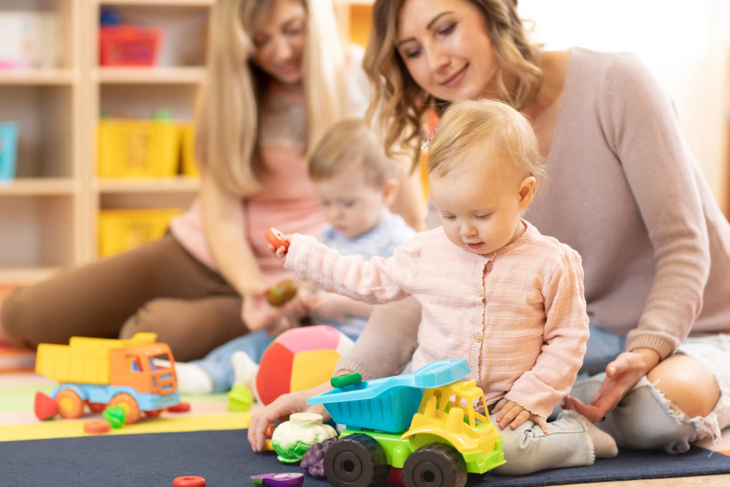 Staff playing with children